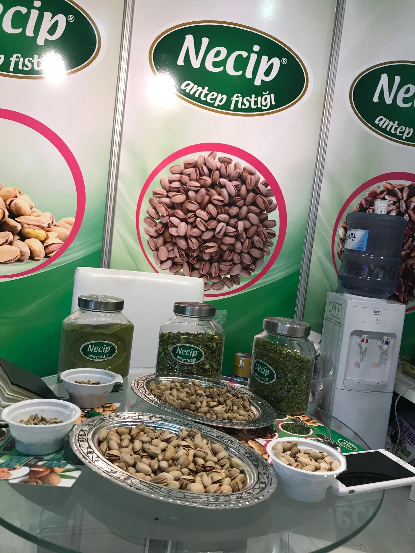 Premium pistachio product display with samples and jars